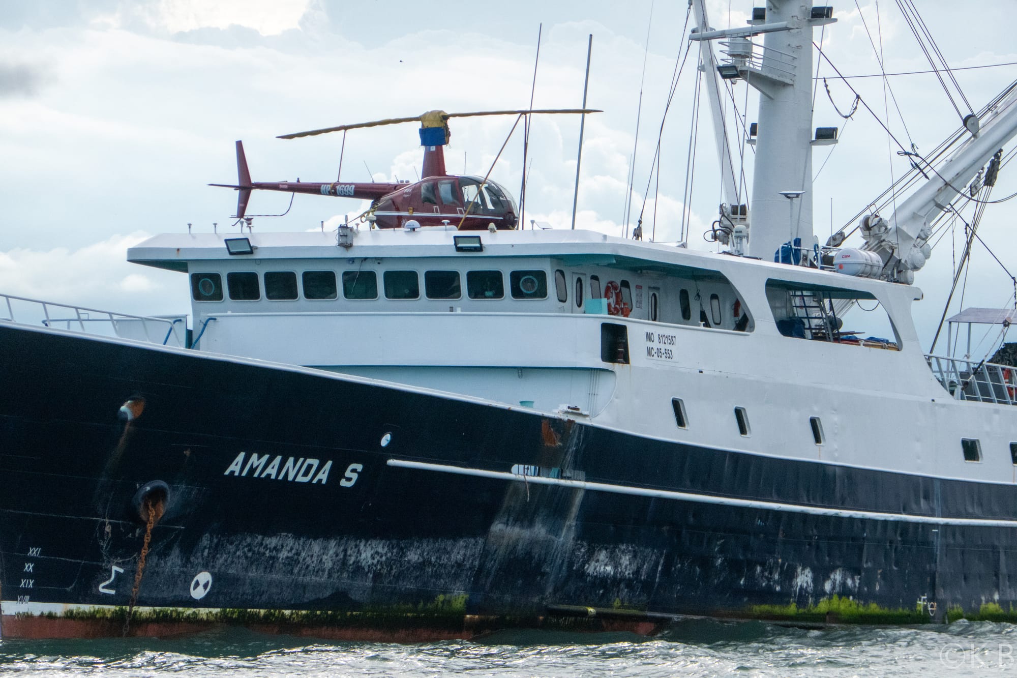 Big fishing boat with a helicopter on top